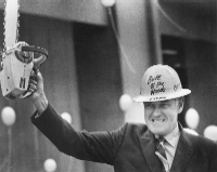 Photo - Governor Tom McCall with Chainsaw