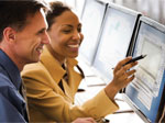 coworkers working on project on computer