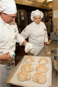 Culinary students baking bread