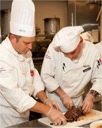 Culinary students preparing food for plating