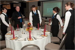 Students and instructor discussing table setting