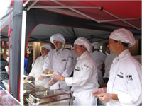 students serving/preparing at event