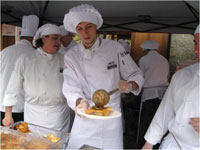 students serving/preparing at event