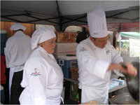 students serving/preparing at event