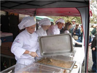 students serving/preparing at event