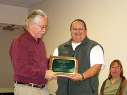 Jerry Hall receiving award from Michael Samano/Diversity Council