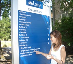 International student using directions board on LCC campus