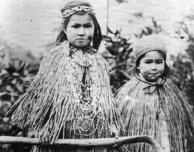 two young girls in capes