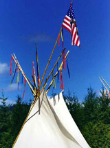 teepee with american flag at powwow