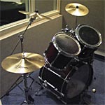 Drum set in isolation booth - link to photo